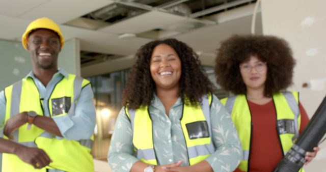 Diverse Group of Contractors Smiling at Construction Site - Download Free Stock Images Pikwizard.com