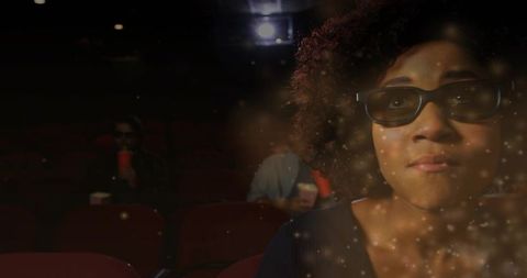 Enchanted cinema moment: woman wearing 3d glasses watching moody late-night screening