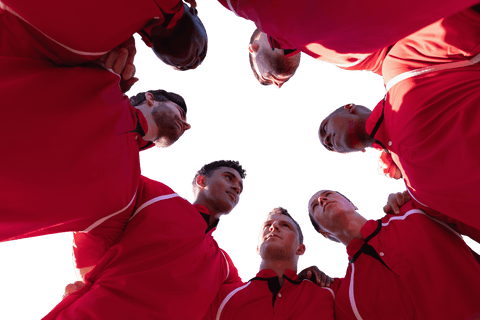 transparent low angle huddle of diverse team in red uniforms - Download Free Stock Videos Pikwizard.com
