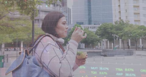 Woman Eating in Urban Environment with Digital Graph Overlay