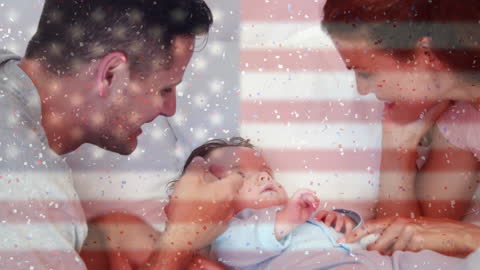 Joyful Family Celebrating with Baby Overlaid with US Flag