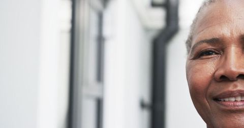 Close-up Partial Portrait of Smiling Senior African American Woman Outdoors