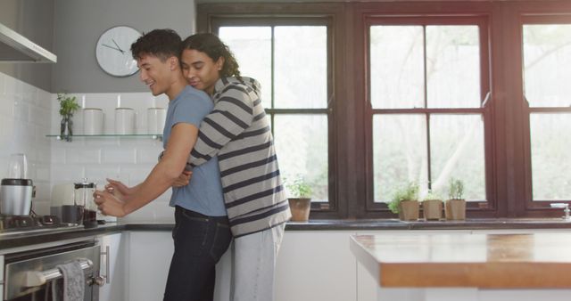Happy Couple Hugging in Modern Kitchen Preparing Coffee - Download Free Stock Images Pikwizard.com