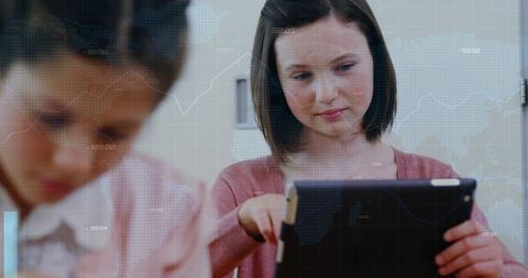 Teenage Girl Studying with Tablet Analyzing Digital Charts and Global Data Overlay for Learning
