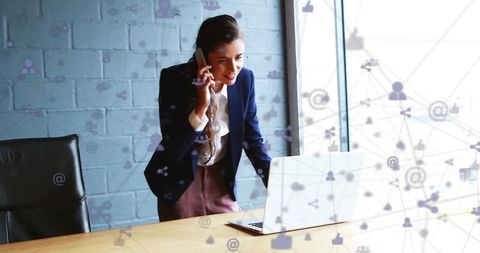 Businesswoman Engaged in Global Communication via Smartphone and Laptop - Download Free Stock Images Pikwizard.com