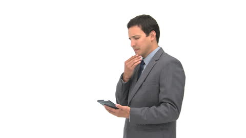 Business Professional Analyzing Data on Tablet