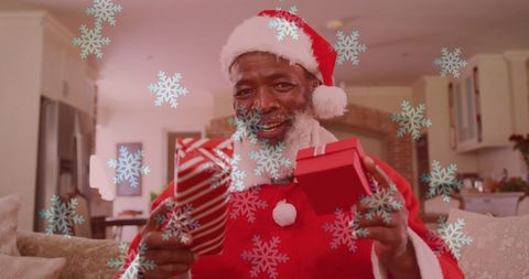 Festive Man in Santa Costume Enjoying Virtual Christmas Celebration