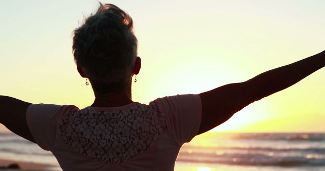 Senior Woman Embracing Sunset at Beach, Freedom and Peace Concept - Download Free Stock Images Pikwizard.com