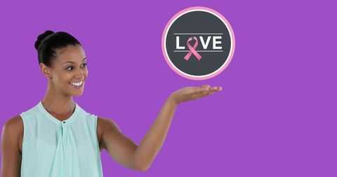 Breast Cancer Awareness Campaign with Smiling Woman Holding Symbol - Download Free Stock Images Pikwizard.com