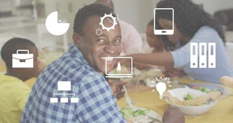 Smiling man sharing family dinner with digital icons overlay, lifestyle and tech concept