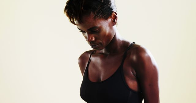 Serene African American Woman in Sports Bra - Download Free Stock Images Pikwizard.com