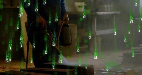 Metalworker using dual torches in workshop with technical code overlay