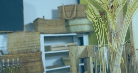 Rustic corner with wheat stalks and vintage baskets