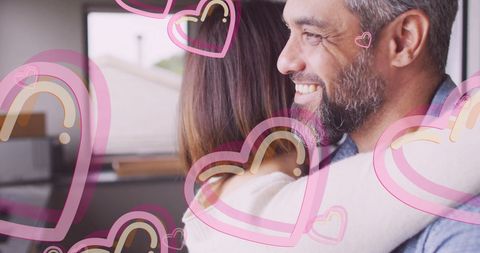 Diverse Couple Embracing and Smiling Inside Cozy Home