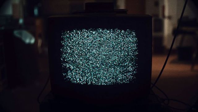Retro CRT Television with Static Noise in Dim Ambient Lighting