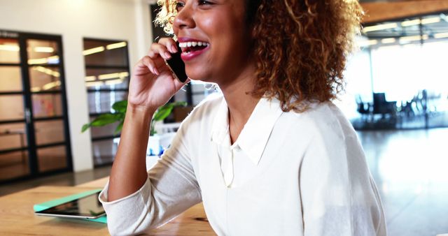 Happy Businesswoman Talking on Mobile Phone in Modern Office - Download Free Stock Images Pikwizard.com