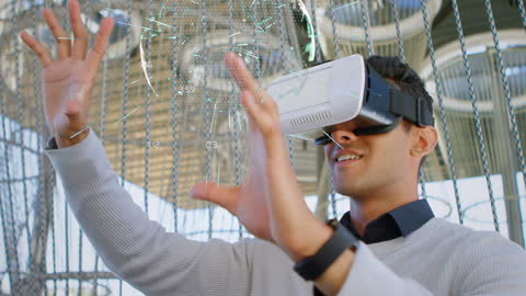 Businessman Using VR Headset Visualizing Data Projections
