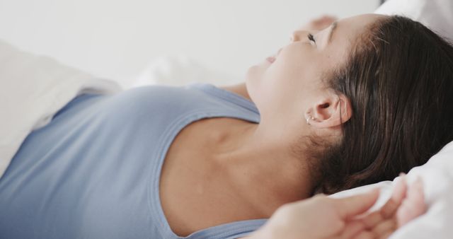 Young Woman Stretching in Bed After Waking Up - Download Free Stock Images Pikwizard.com