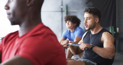 Group rowing workout with focus on strong athletic movement