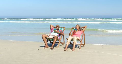 Relaxed Senior African American Couple Enjoying Beach Day - Download Free Stock Images Pikwizard.com