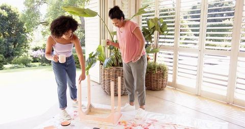 Mother and daughter diy furniture assembly at home
