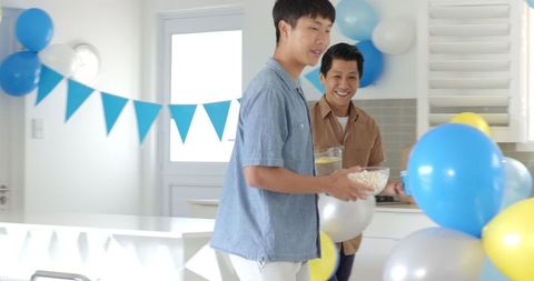 Men Setting Up Snacks for Family Celebration