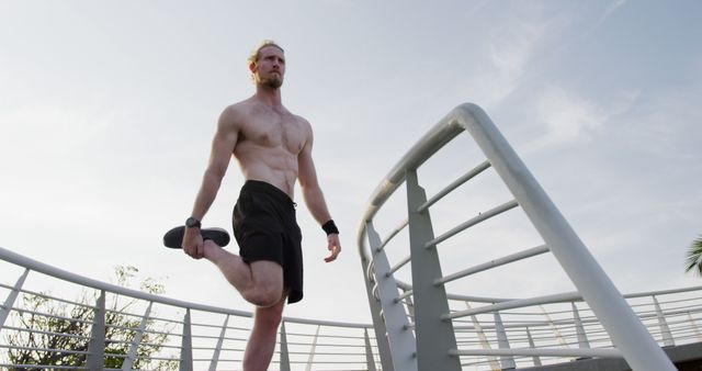 Fit Young Man Stretching Outdoors on Bridge - Download Free Stock Images Pikwizard.com