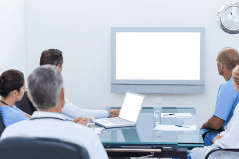 Transparent medical team meeting with blank integrated screen