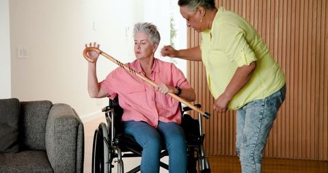 Caring senior couple adjusting aid for mobility