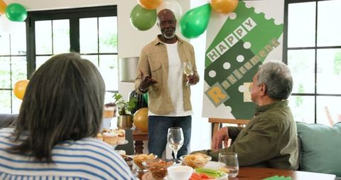 Senior Friends Celebrating Retirement Party in Living Room
