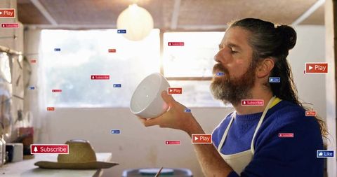 Artisan contemplates craftwork amidst digital overload