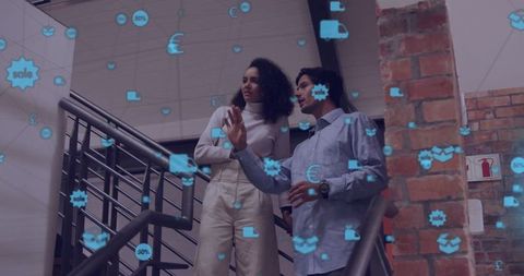 Diverse Colleagues Discussing Work Surrounded by Digital Connections Icons