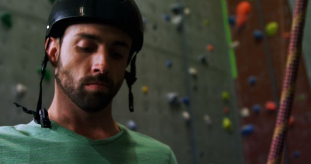 Male Climber Focusing While Rock Climbing Indoors - Download Free Stock Images Pikwizard.com