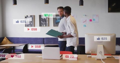 Colleagues collaborating over social media engagement analytics in modern open office
