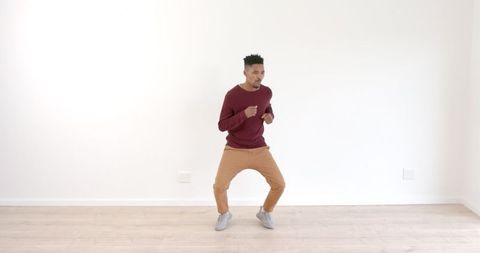 Energetic Urban Dance by Young Man in Casual Attire