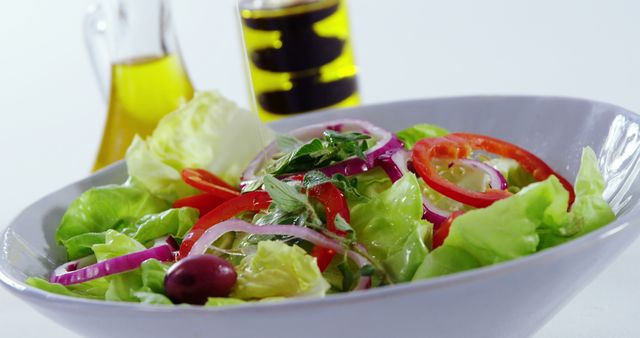 Fresh Vegetable Salad with Olive Oil on White Background - Download Free Stock Images Pikwizard.com