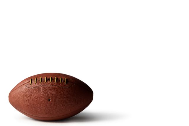 Close up of brown American football against white background