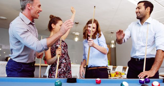 Business Team Enjoying Friendly Game of Billiards During Break - Download Free Stock Images Pikwizard.com