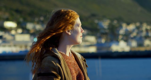 Woman with Red Hair Enjoying Scenic Waterfront View - Download Free Stock Images Pikwizard.com