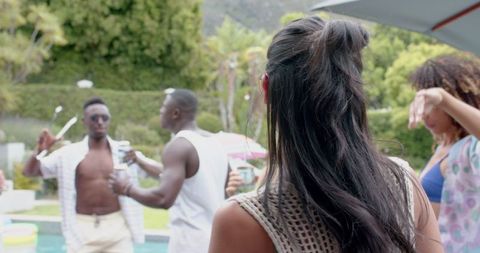 Friends Celebrating Energetic Pool Party Outdoors