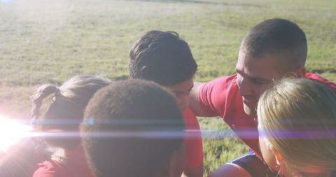 Team huddle with coach at stadium celebrates sportsmanship