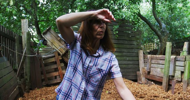 Woman Exploring Rustic Backyard with Piled Wooden Crates - Download Free Stock Images Pikwizard.com
