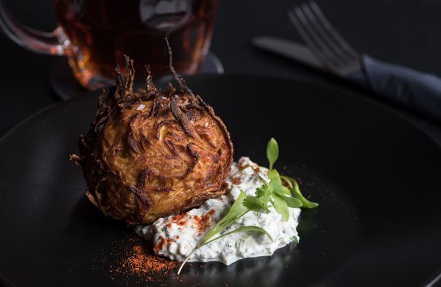 Gourmet Arancini Ball with Creamy Herb Sauce on Dark Background - Download Free Stock Images Pikwizard.com