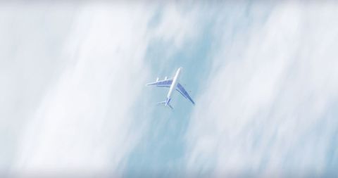 Airplane Flying Above Cloudscape in Blue Skies - Download Free Stock Images Pikwizard.com