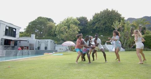 Energetic Friends Playing in Sunny Backyard Filled With Laughter - Download Free Stock Images Pikwizard.com
