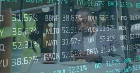 Businessman analyzing stock figures on smartphone