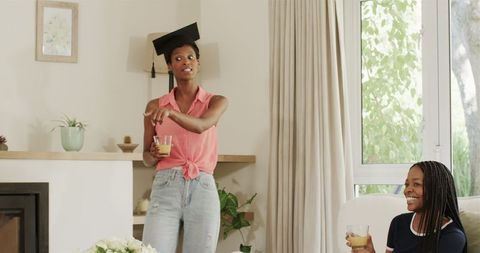 Graduate Excitedly Speaking at Home Gathering