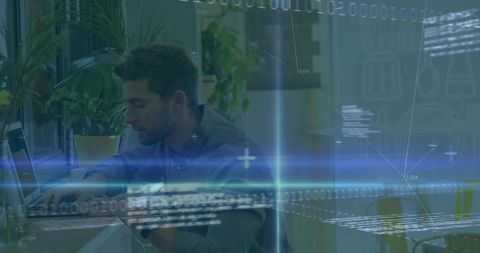 Male software developer coding in modern office with digital overlay