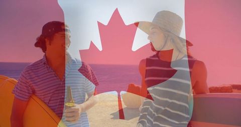 Friends Chatting on Canadian Coast with Surfboards and Sunset