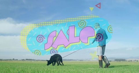 Older man walking black dog across grassy field with vibrant sale graphic overlay